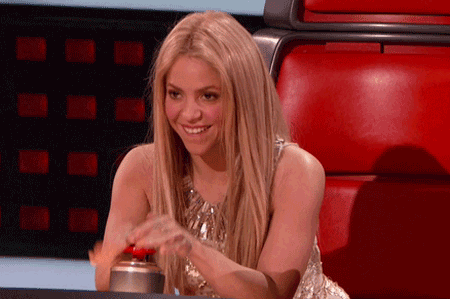 shakira pressing the button in the voice